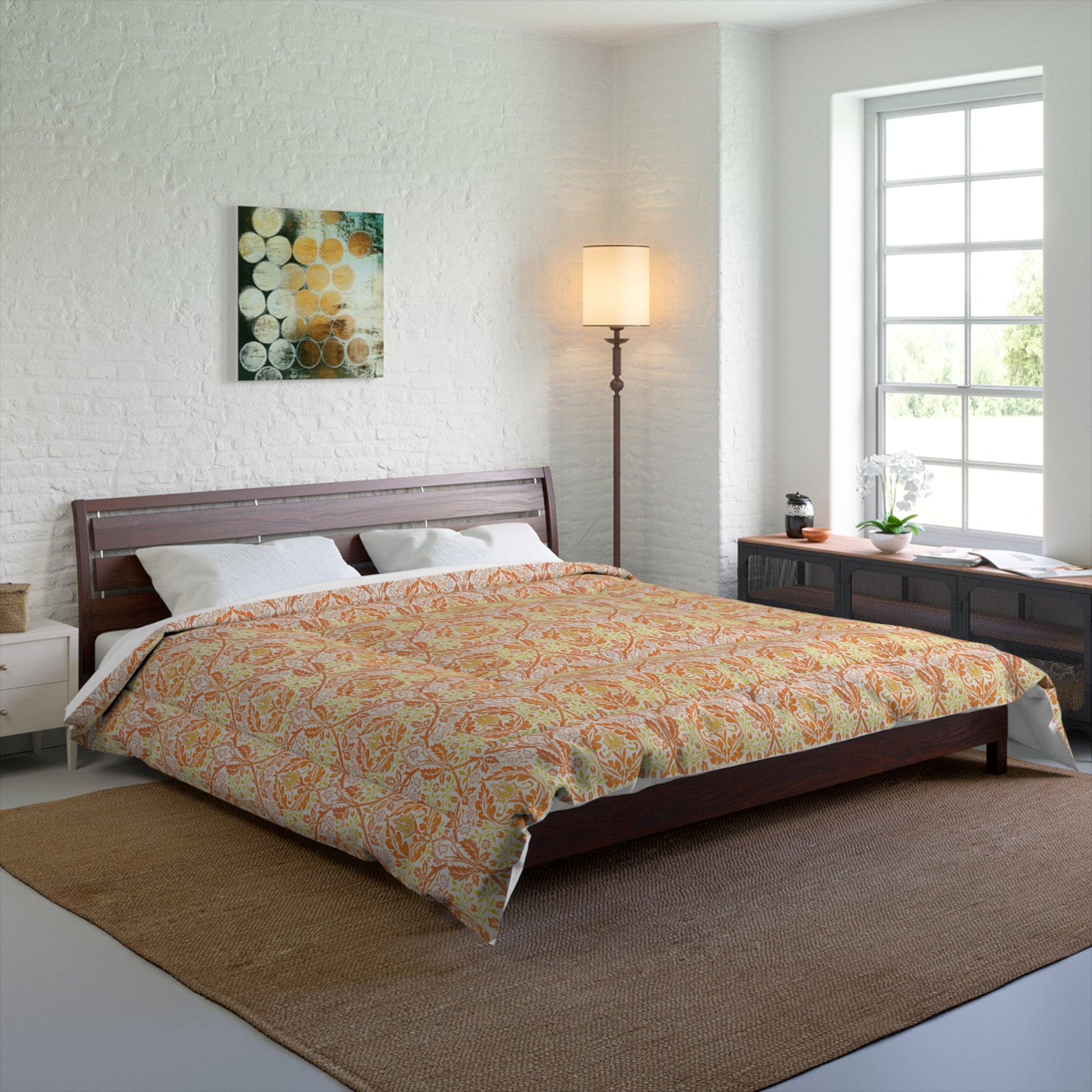 A comforter with a geometric William Morris & Co pattern called Golden Bough in shades of yellow, white, and orange.