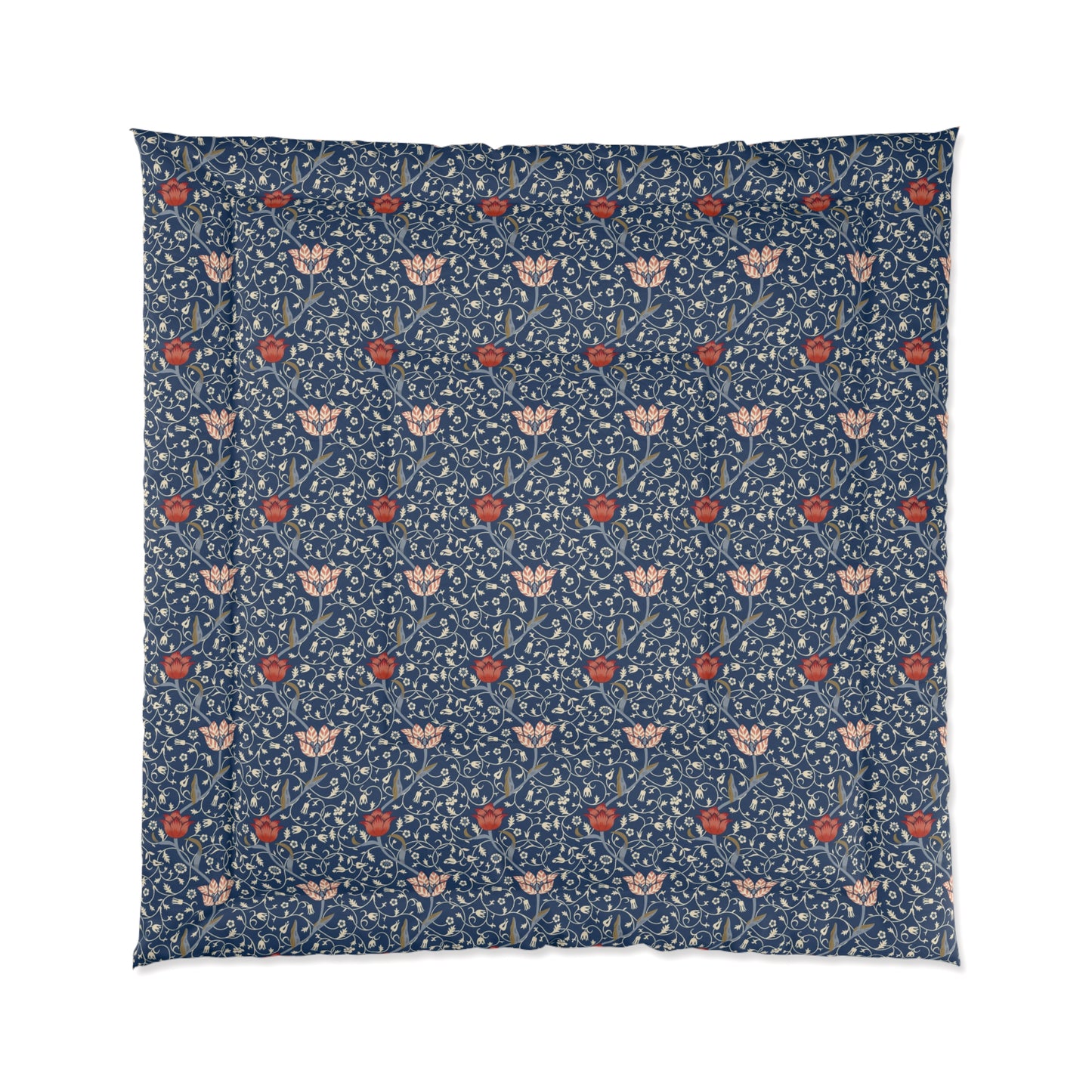 A square-shaped comforter with a blue background featuring a repeating William Morris & Co pattern of red and white apple designs and a plush batting layer visible on one side.