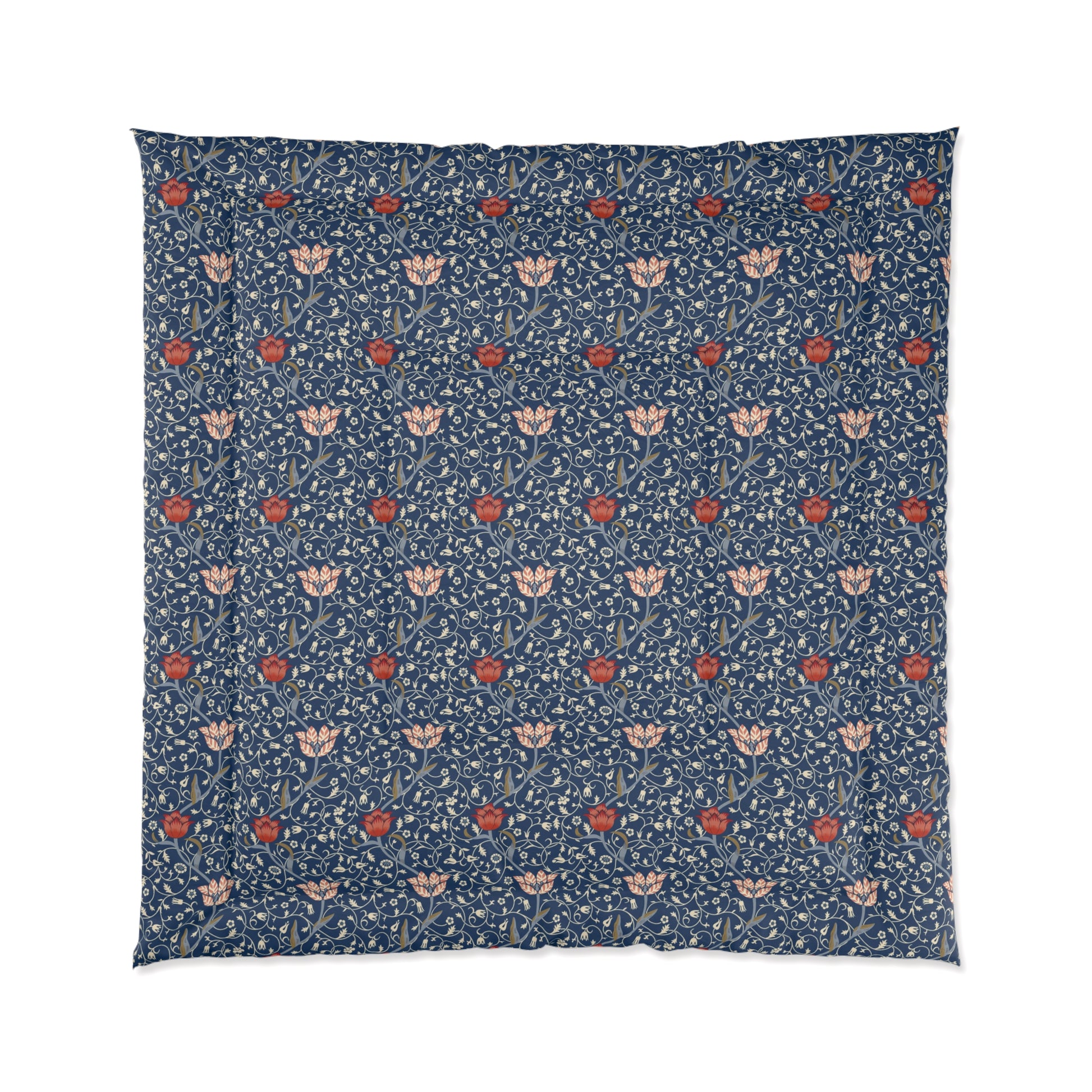A square-shaped comforter with a blue background featuring a repeating William Morris & Co pattern of red and white apple designs and a plush batting layer visible on one side.
