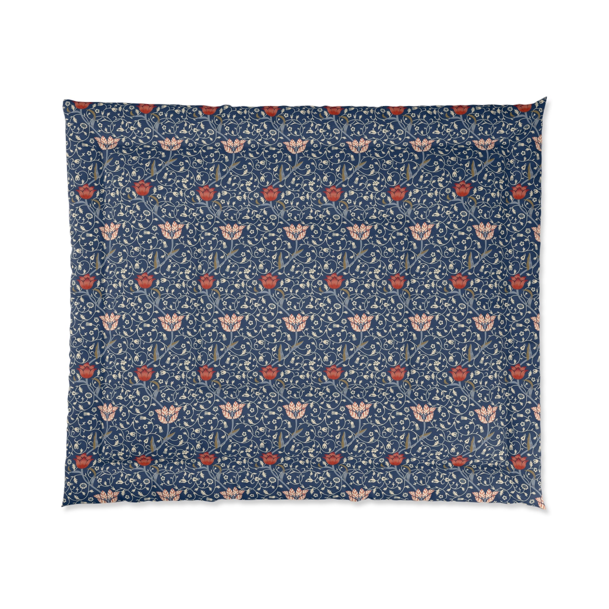 A square-shaped comforter with a blue background featuring a repeating William Morris & Co pattern of red and white apple designs and a plush batting layer visible on one side.