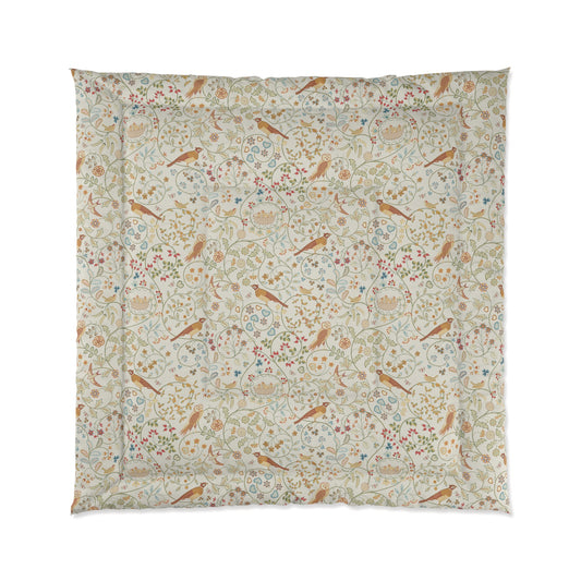 Floral and bird patterned fabric on a white background