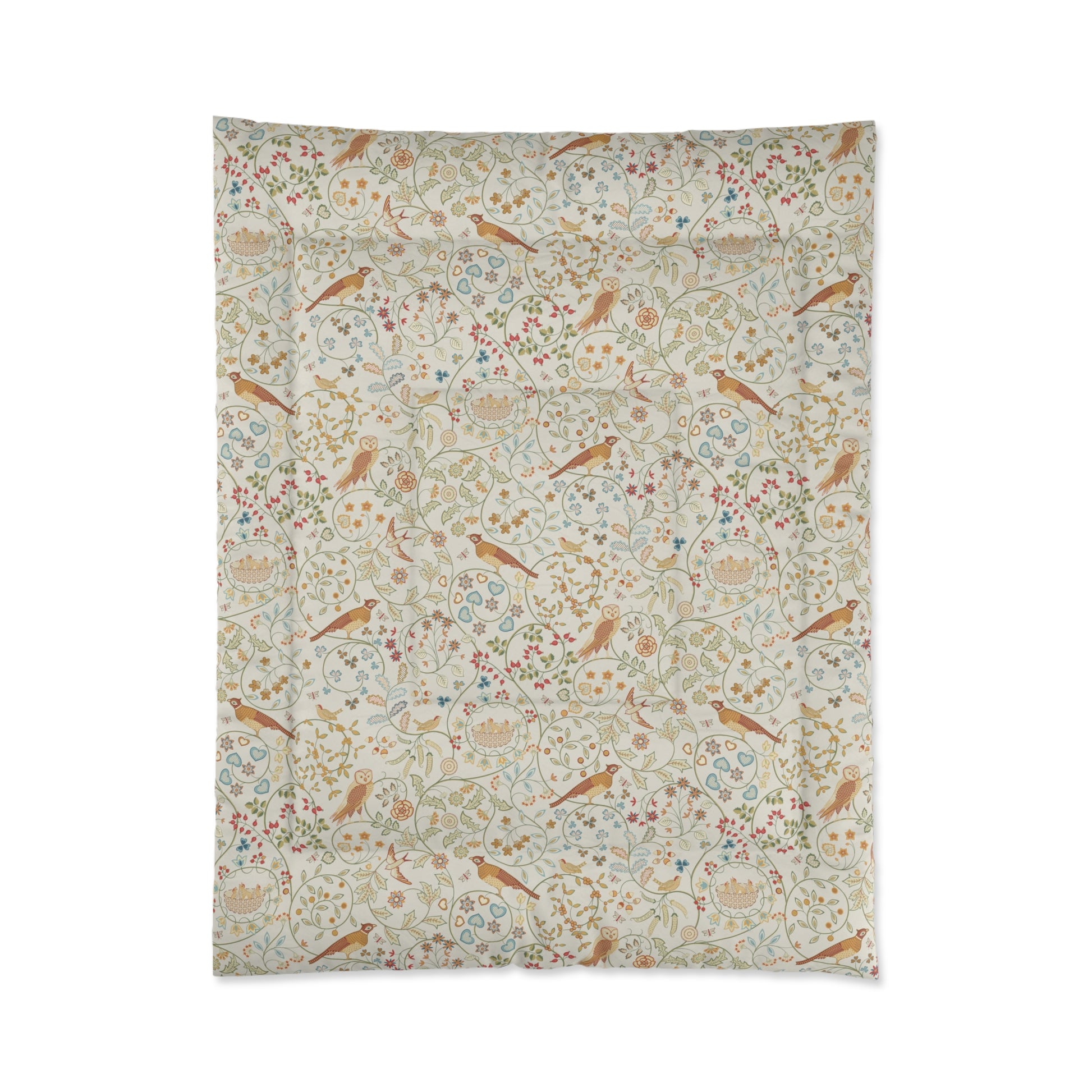 Floral and bird patterned fabric on a white background