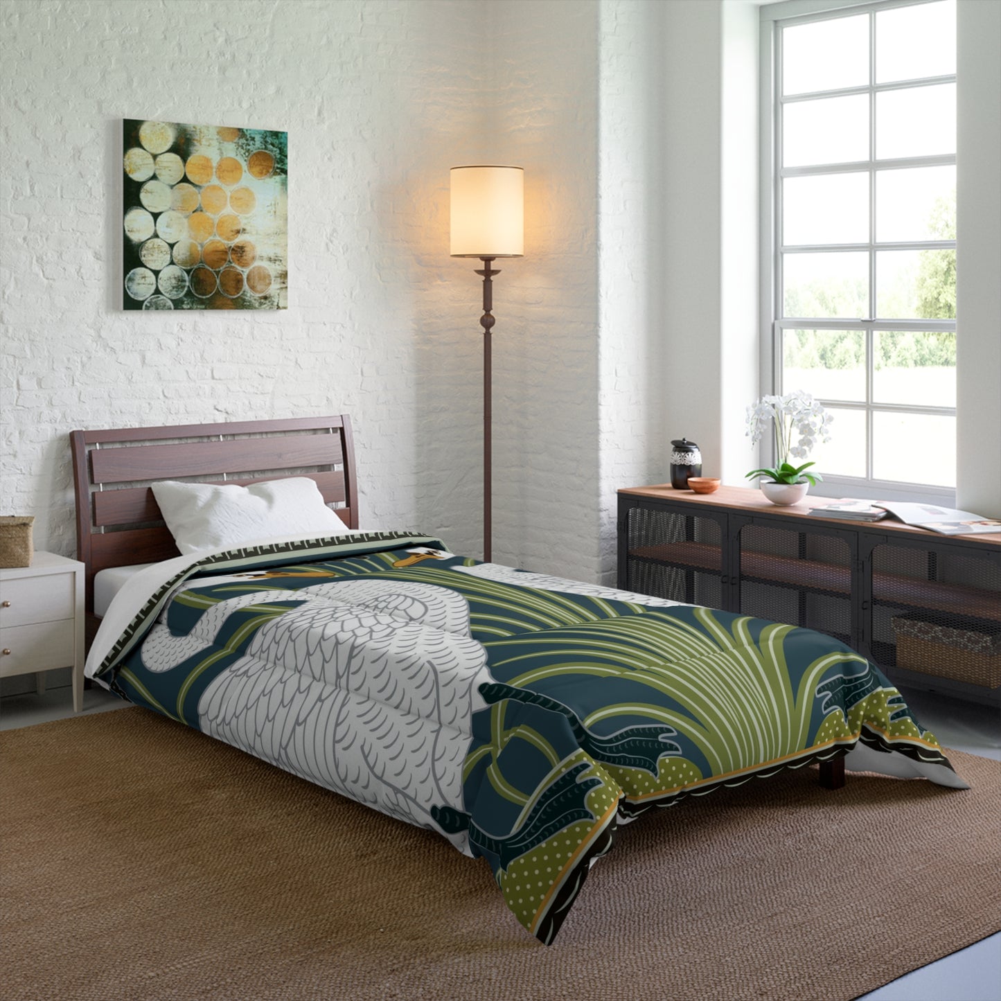 A comforter featuring a double square quilting pattern with a one-sided print of two white swans on a dark green background, surrounded by a floral border in a similar colour palette.