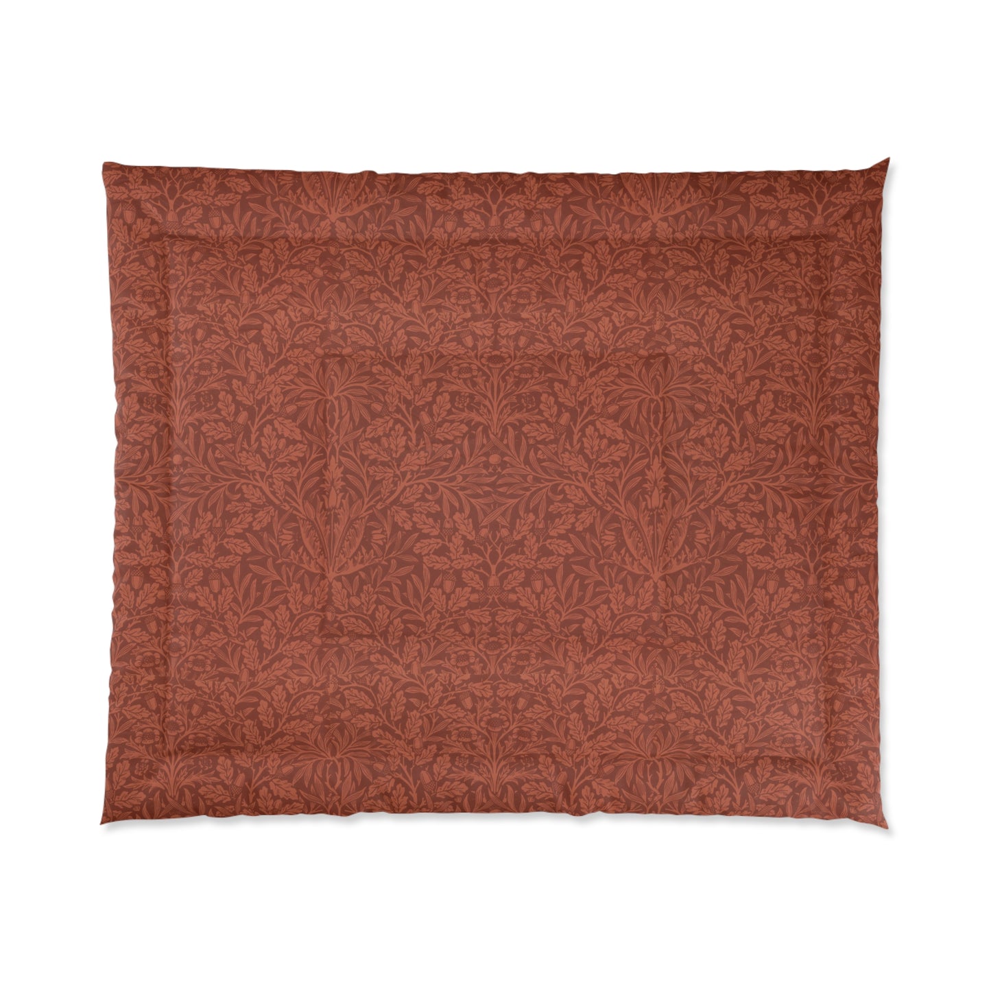 A rectangular comforter with a geometric double square quilting William Morris & Co pattern in a rust colour.