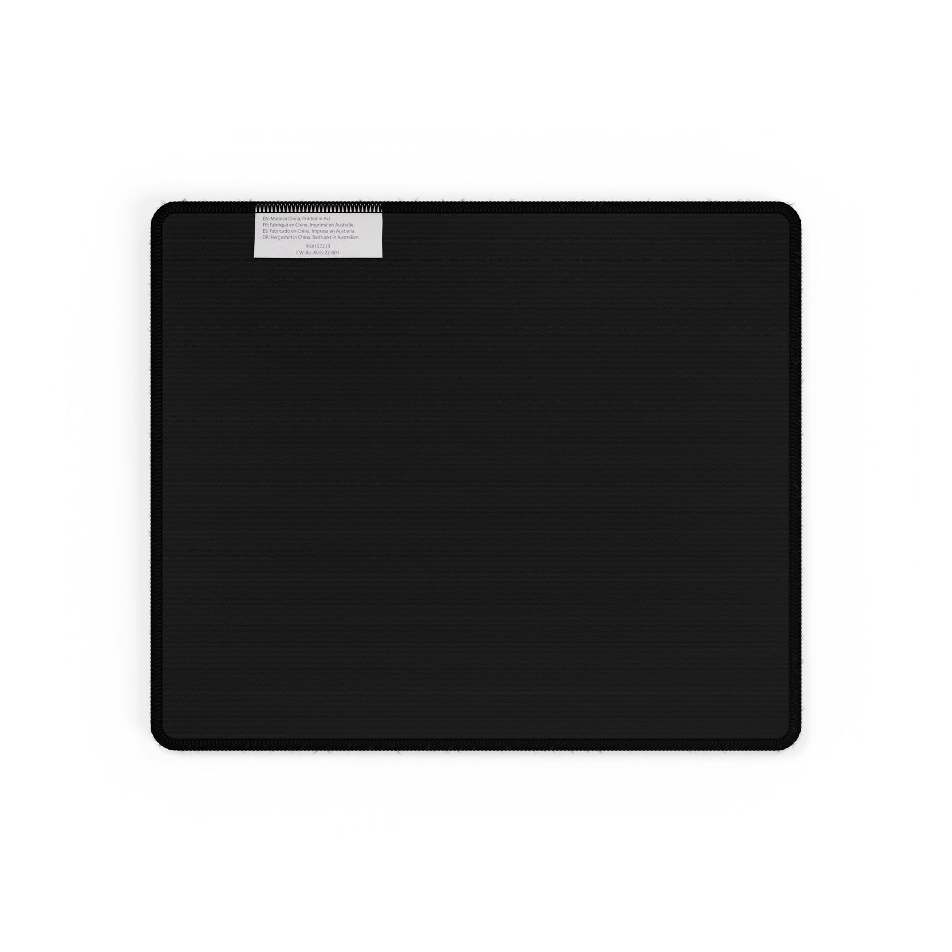 Black rectangular mat with a label on a white background