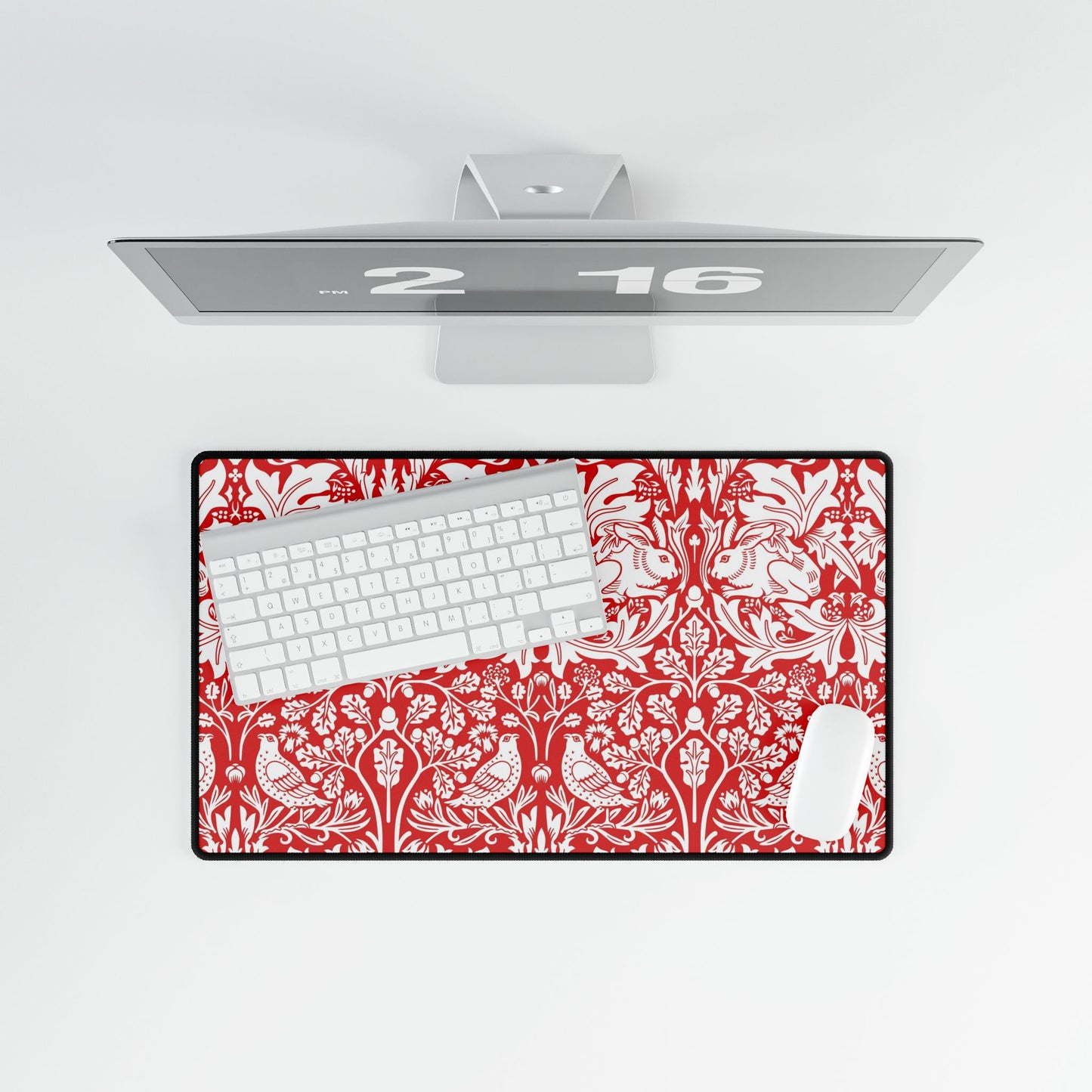 Floral patterned desk mat with keyboard on a white surface