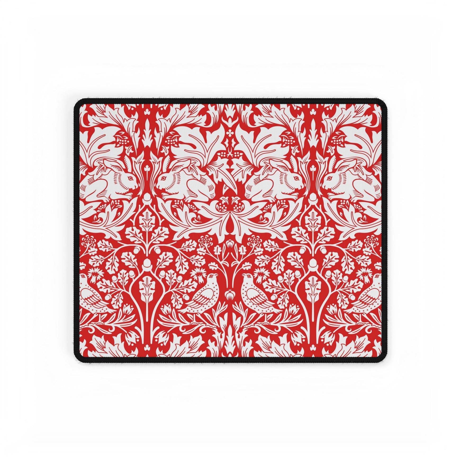 Red and white floral and bird pattern on a black border
