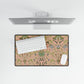 Floral desk mat with a computer setup on a white surface