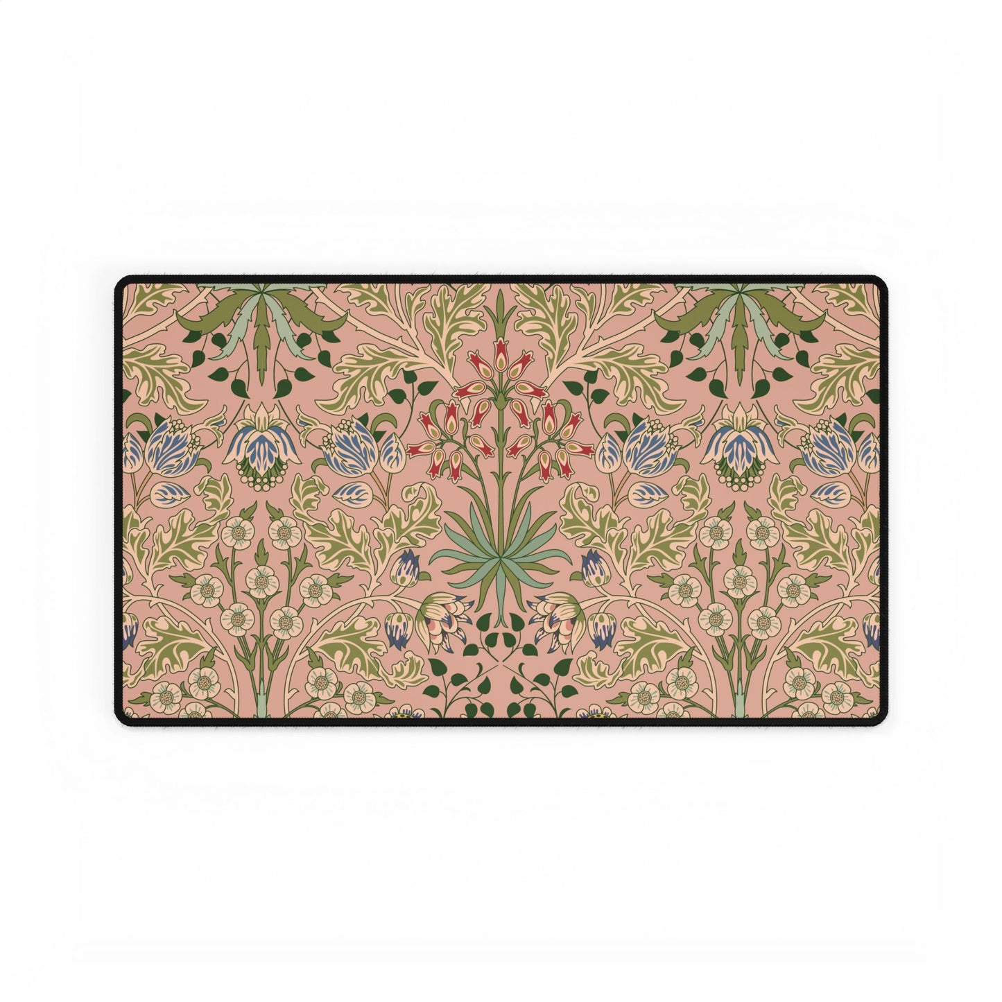 Floral patterned doormat with green and blue flowers on a pink background