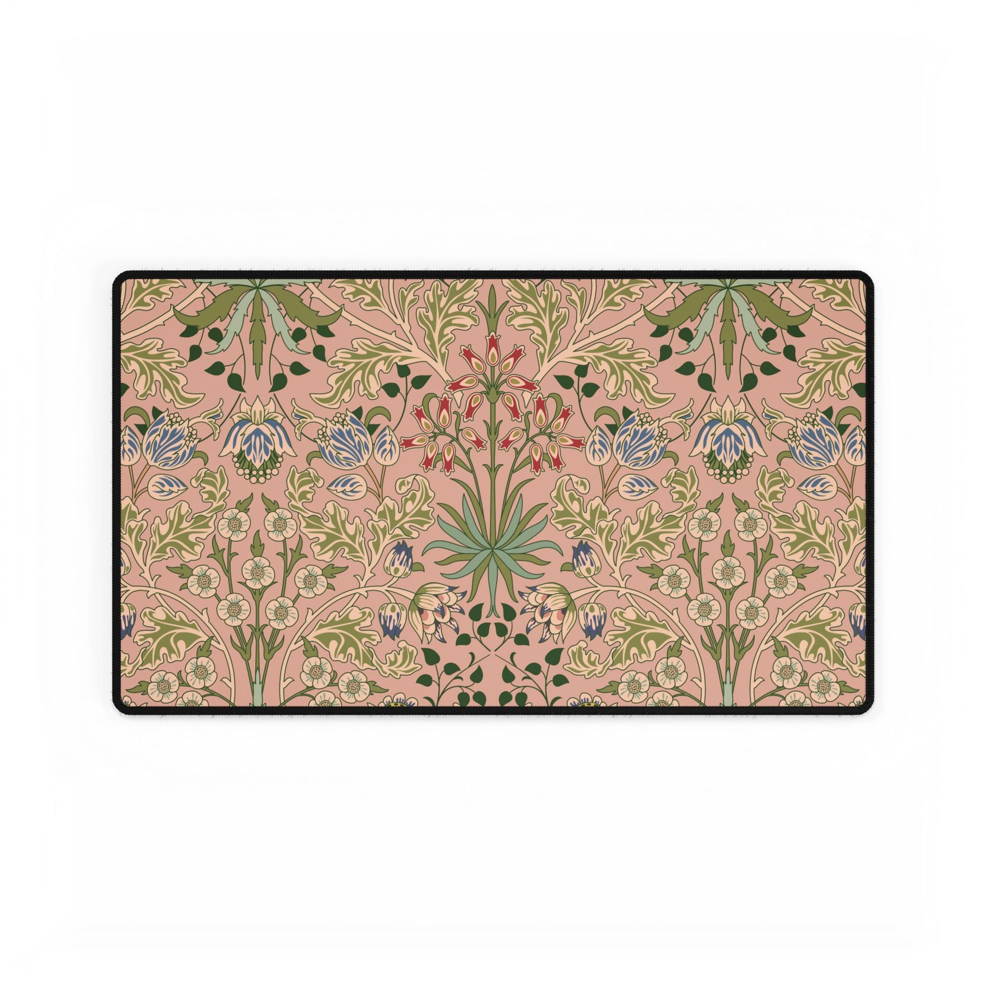 Floral patterned doormat with green and blue flowers on a pink background