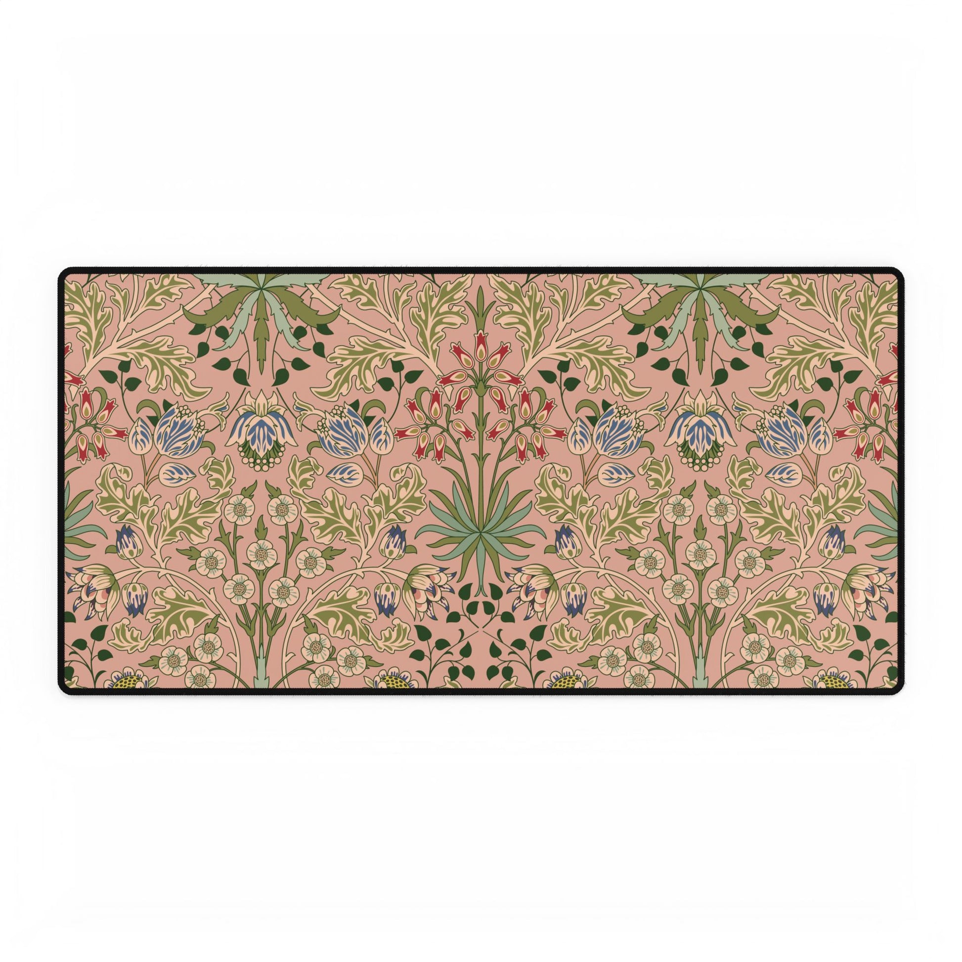 Floral patterned rug with green and blue flowers on a pink background