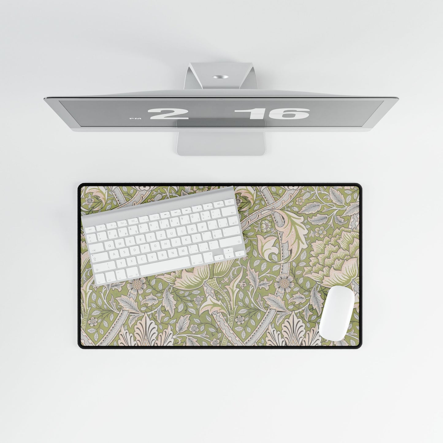 Floral desk mat with keyboard on a white surface