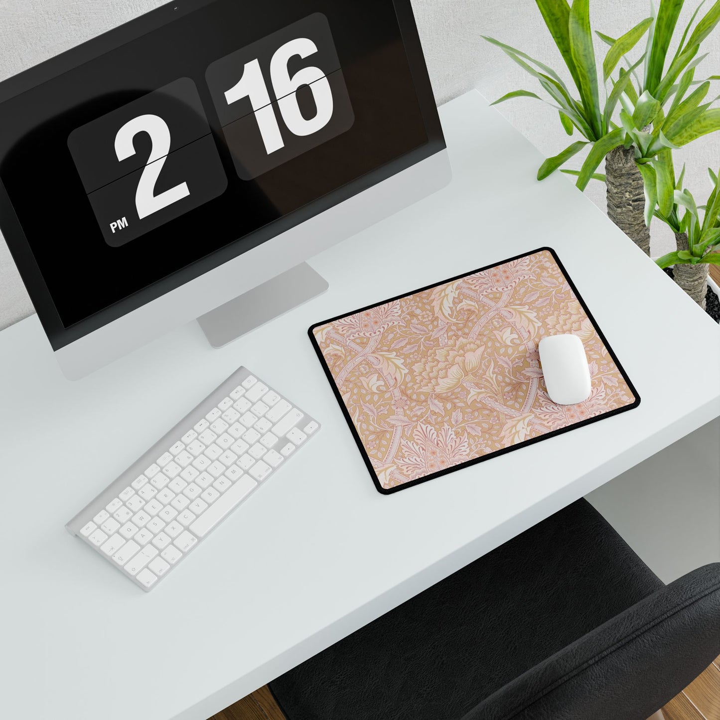 Desk setup with a computer, mouse, and mouse pad featuring a drink design.
