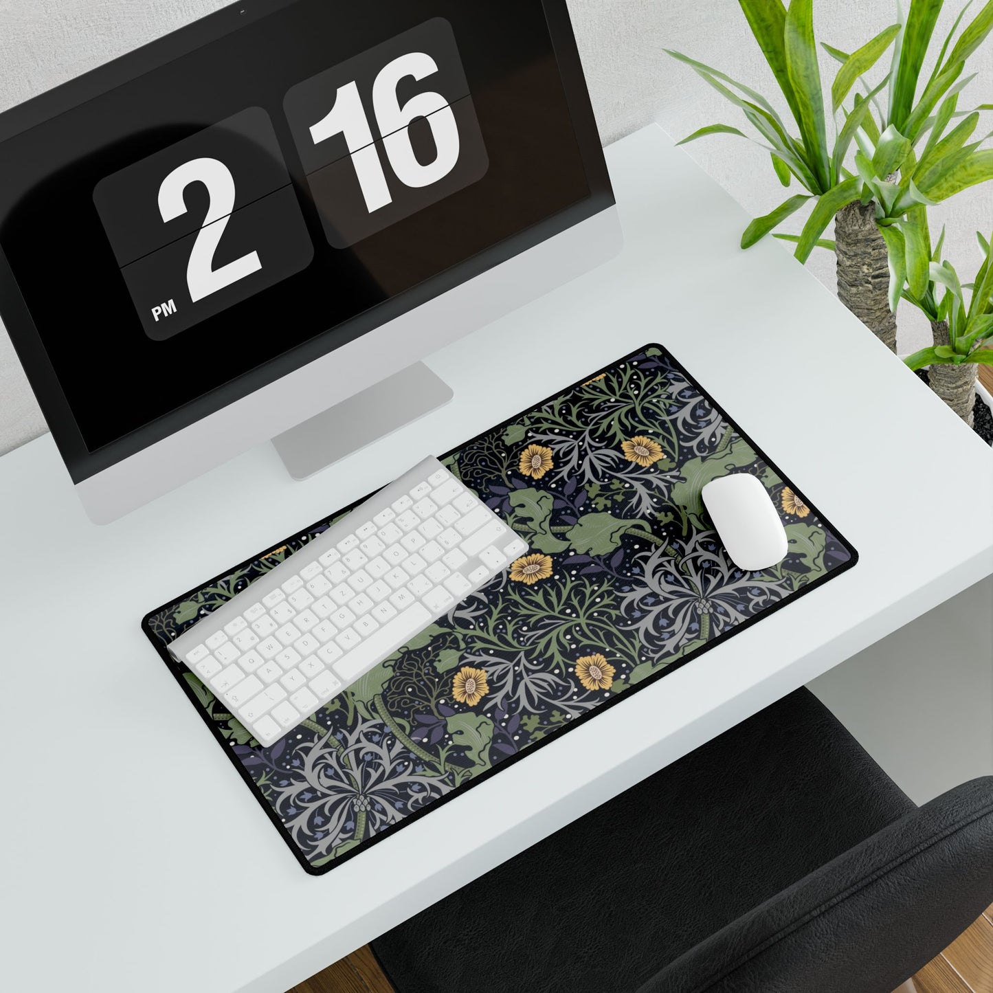 Decorative desk mat with nature design on a desk with computer and plants