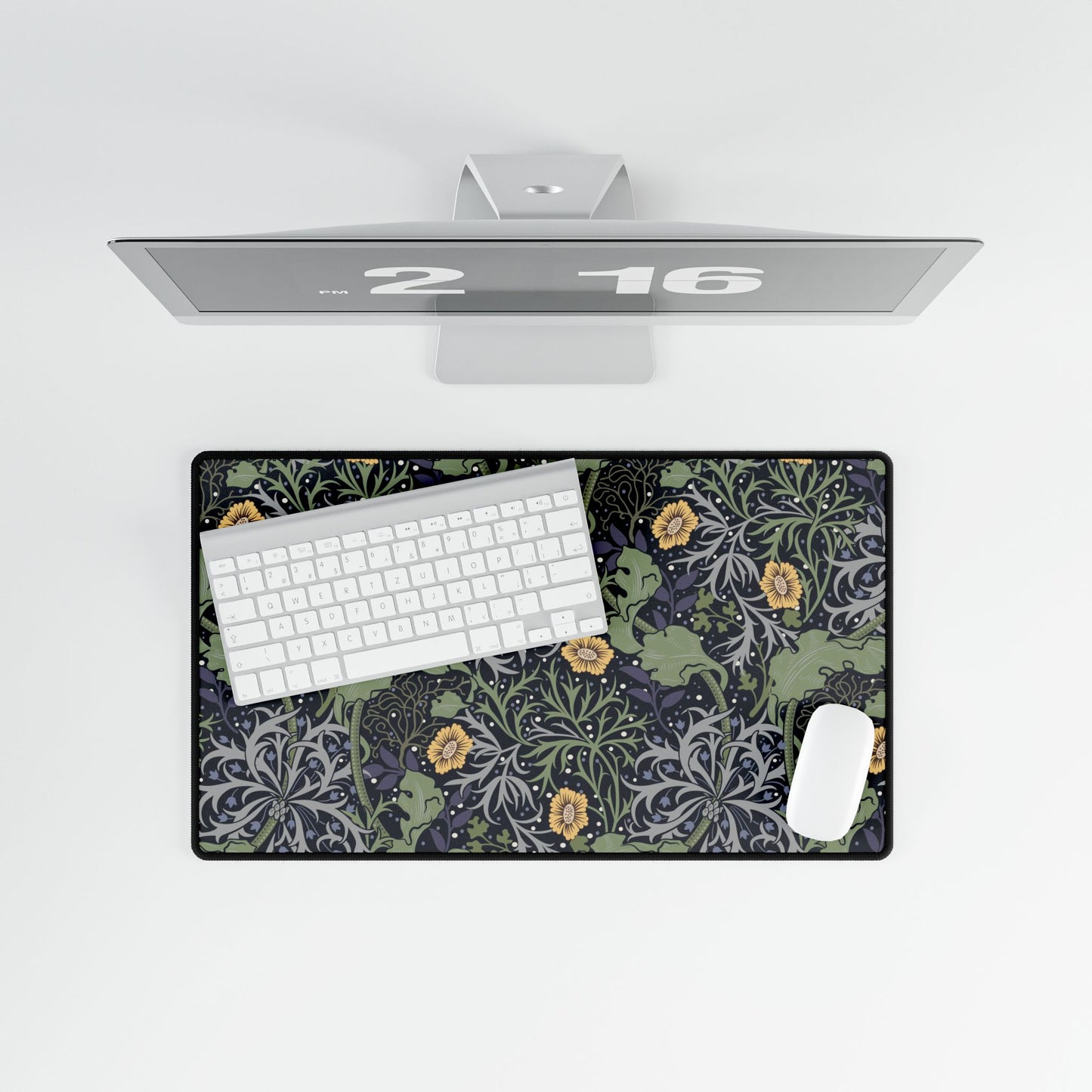 Floral patterned desk mat with keyboard and mouse on a white surface