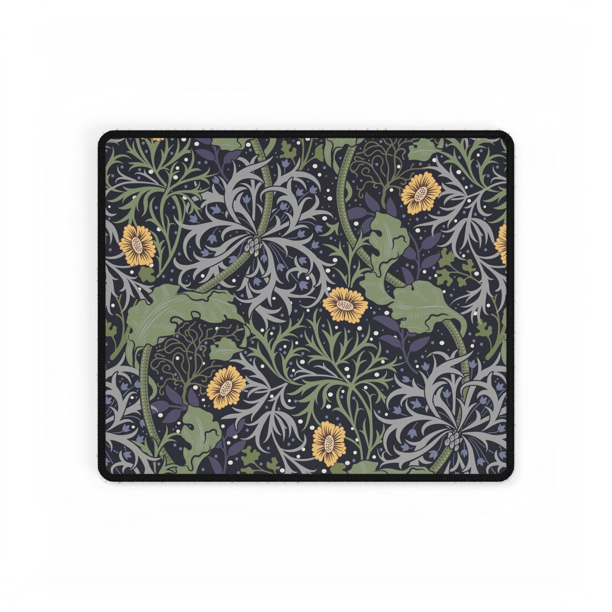 Decorative mouse pad with nature-themed design featuring green leaves, gray patterns, and yellow flowers on a black background.
