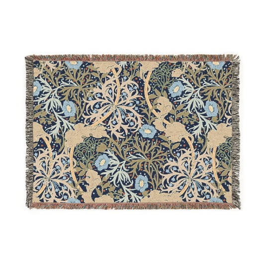 A floral woven blanket in a William Morris & Co pattern with fringed edges displayed on a neutral background.