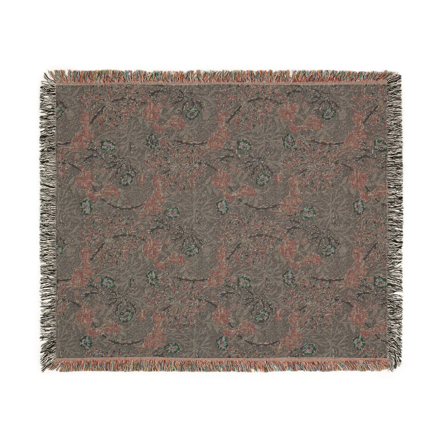 Floral patterned throw blanket with fringe on a white background