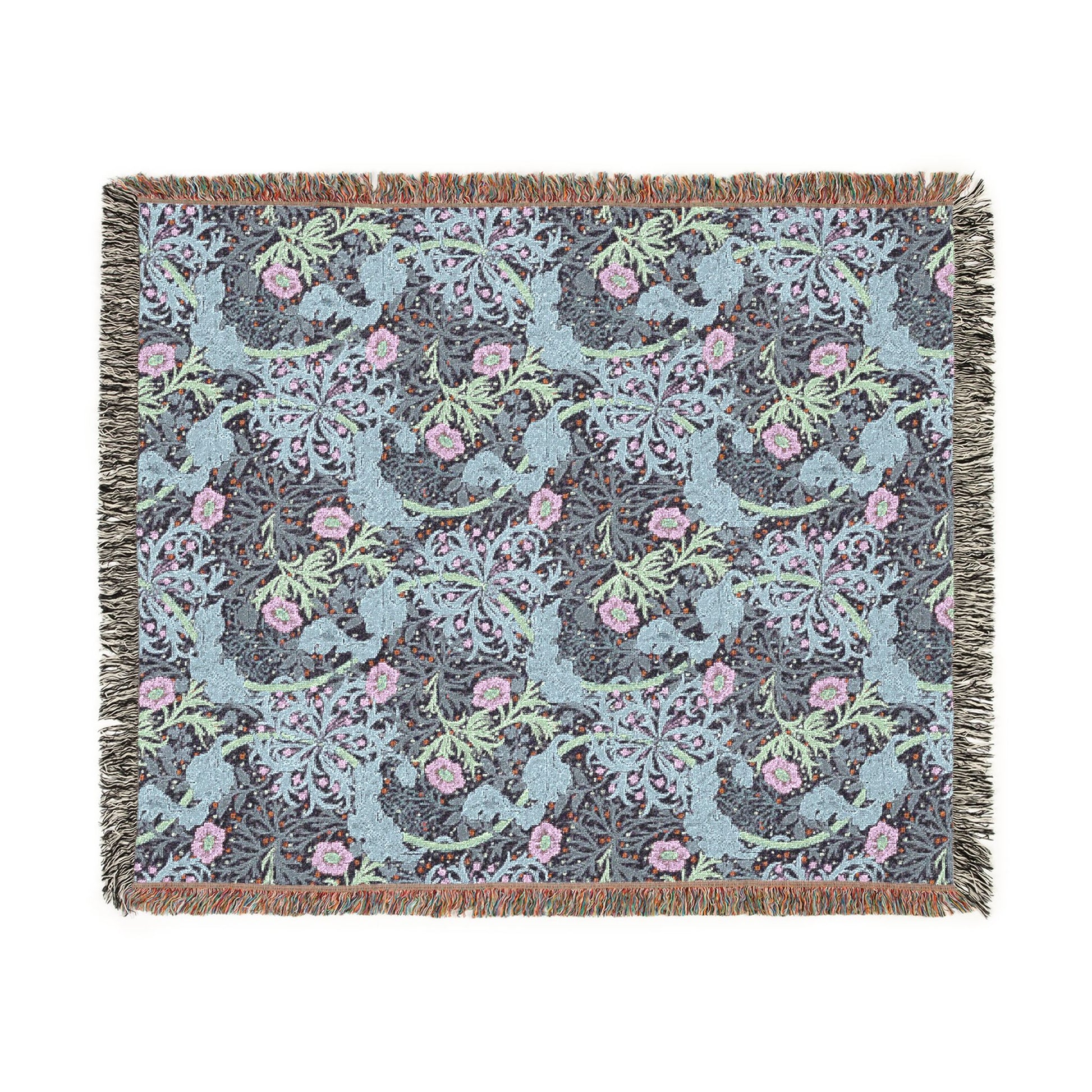 Decorative blanket with floral and bird pattern on a white background