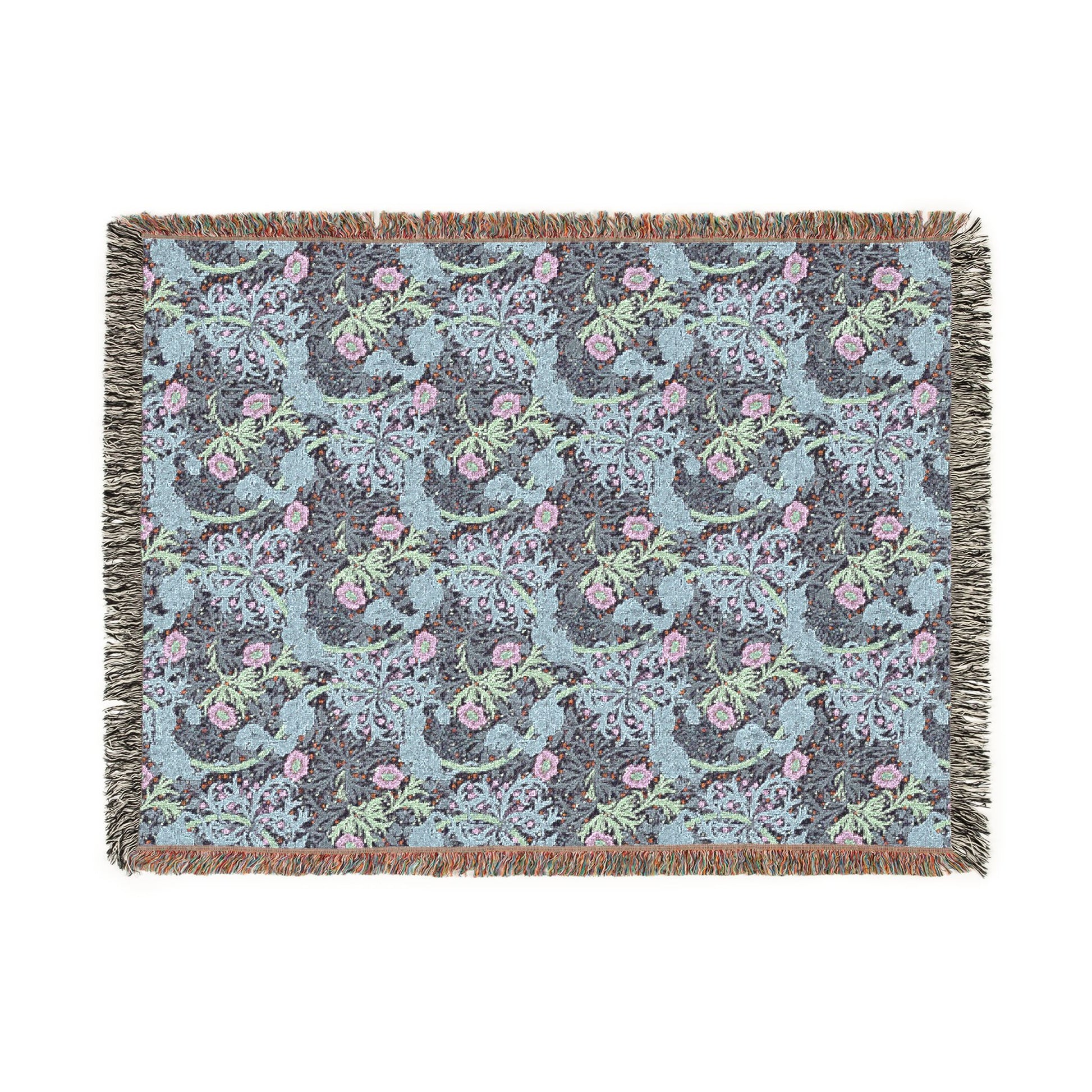 Floral patterned throw blanket with fringe on a white background