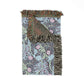 Floral patterned throw blanket with fringes on a white background