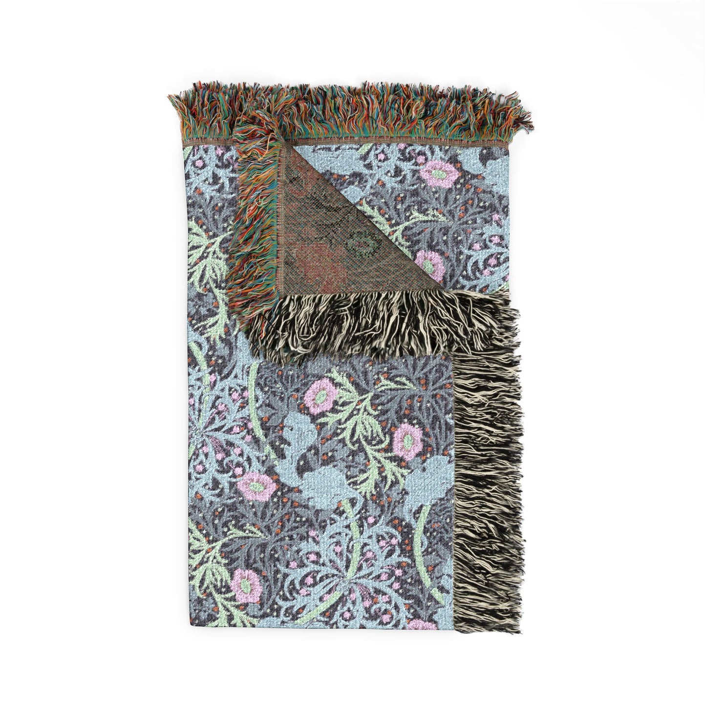 Floral patterned throw blanket with fringes on a white background