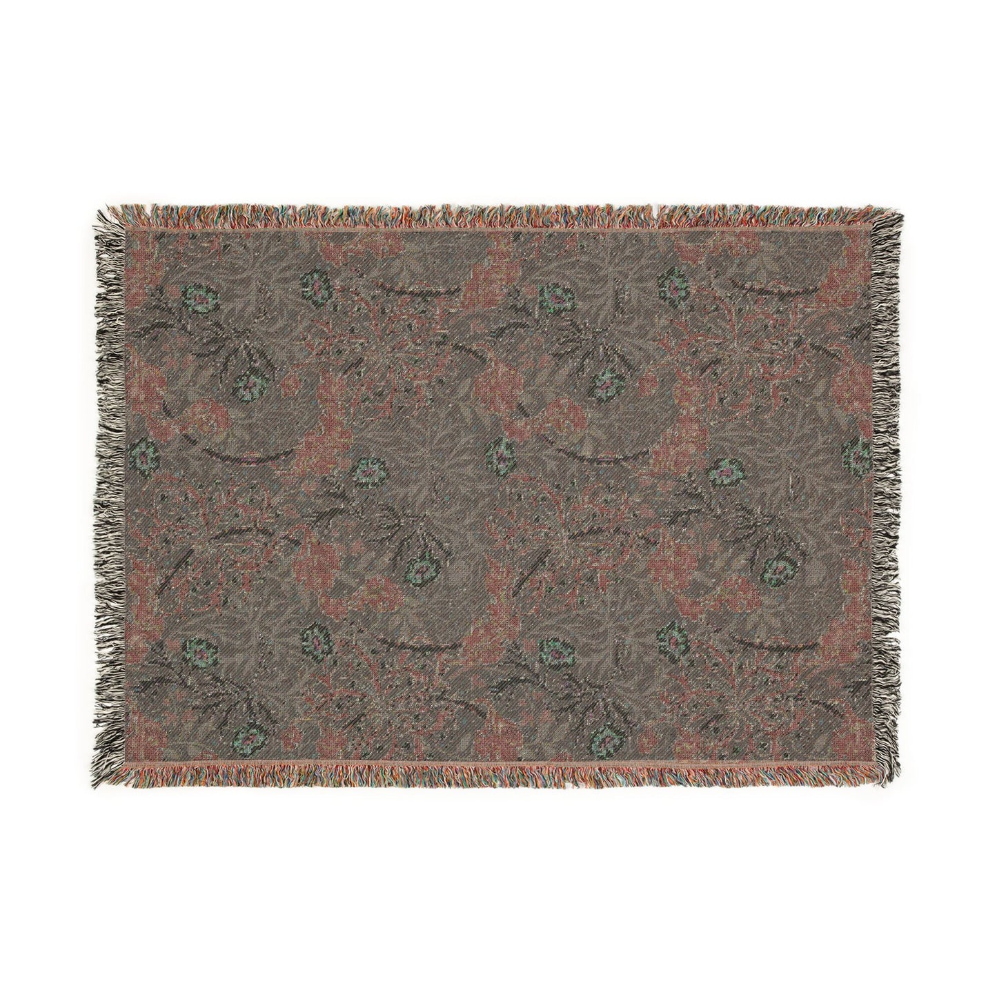 Floral patterned throw blanket with fringe on a white background