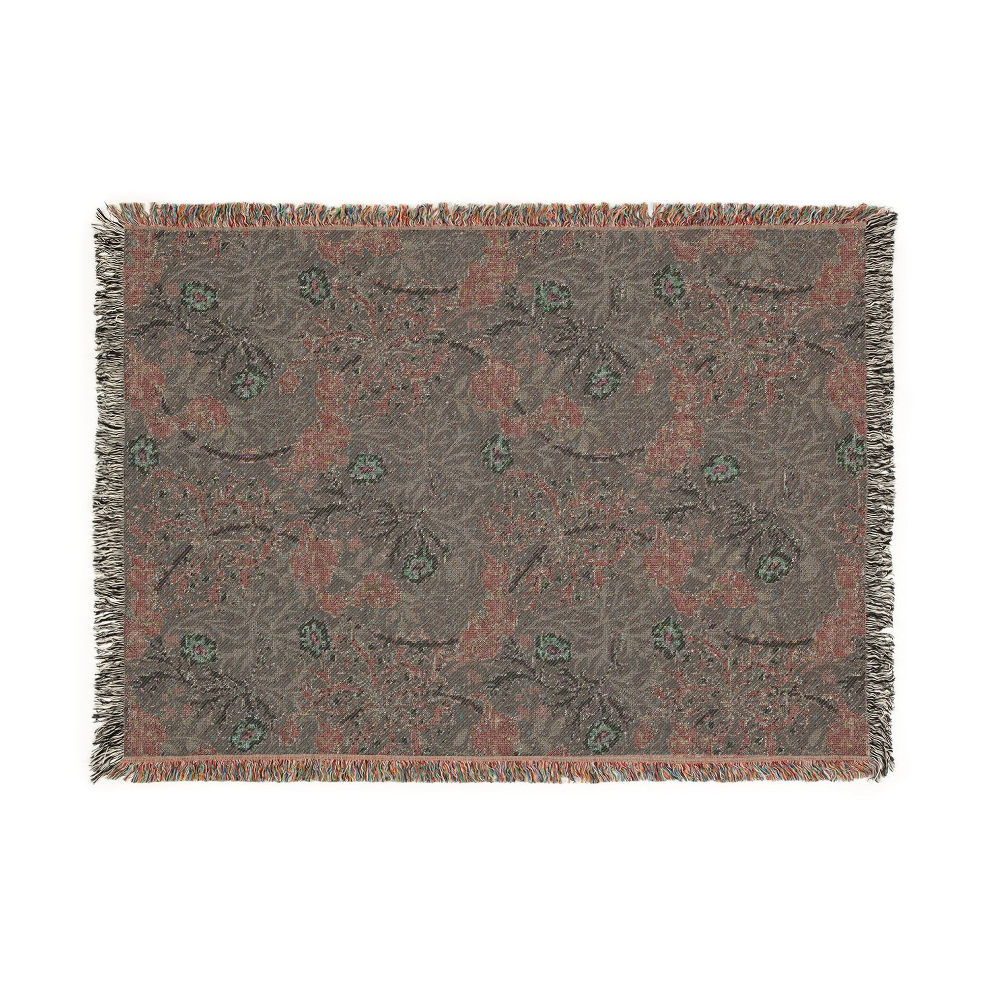 Floral patterned throw blanket with fringe on a white background