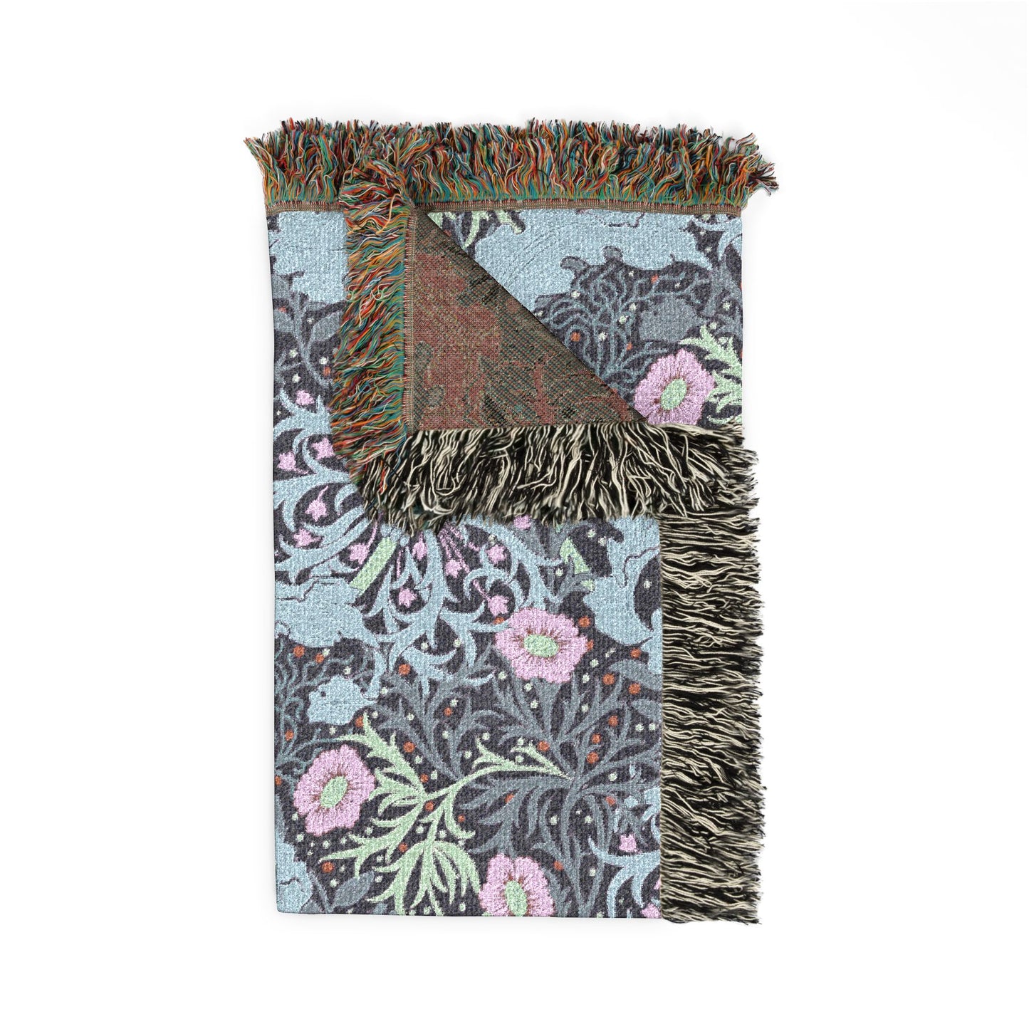 Floral patterned throw blanket with fringed edge on a white background