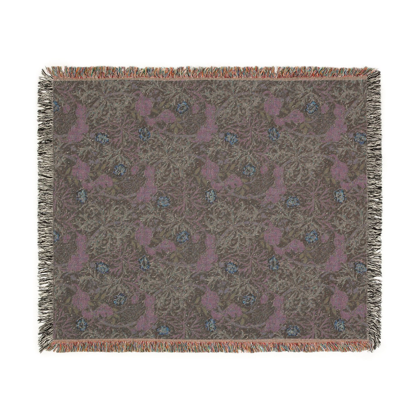 Patterned throw blanket with fringe on a white background