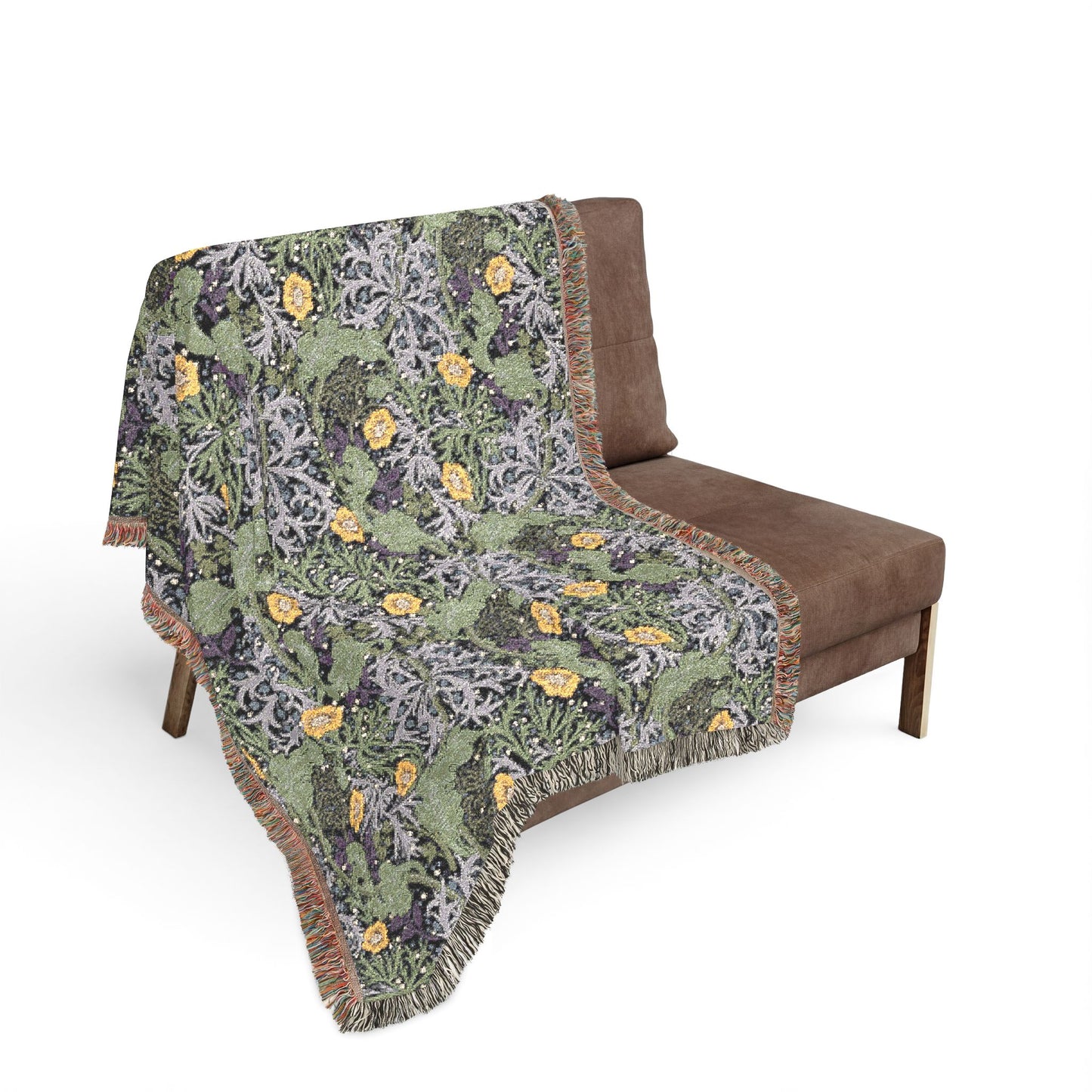 Floral patterned throw blanket draped over a brown chair on a white background
