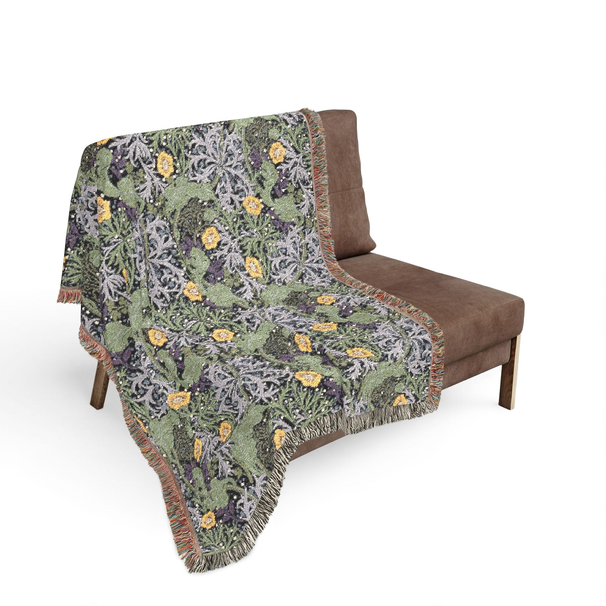 Floral patterned throw blanket draped over a brown chair on a white background