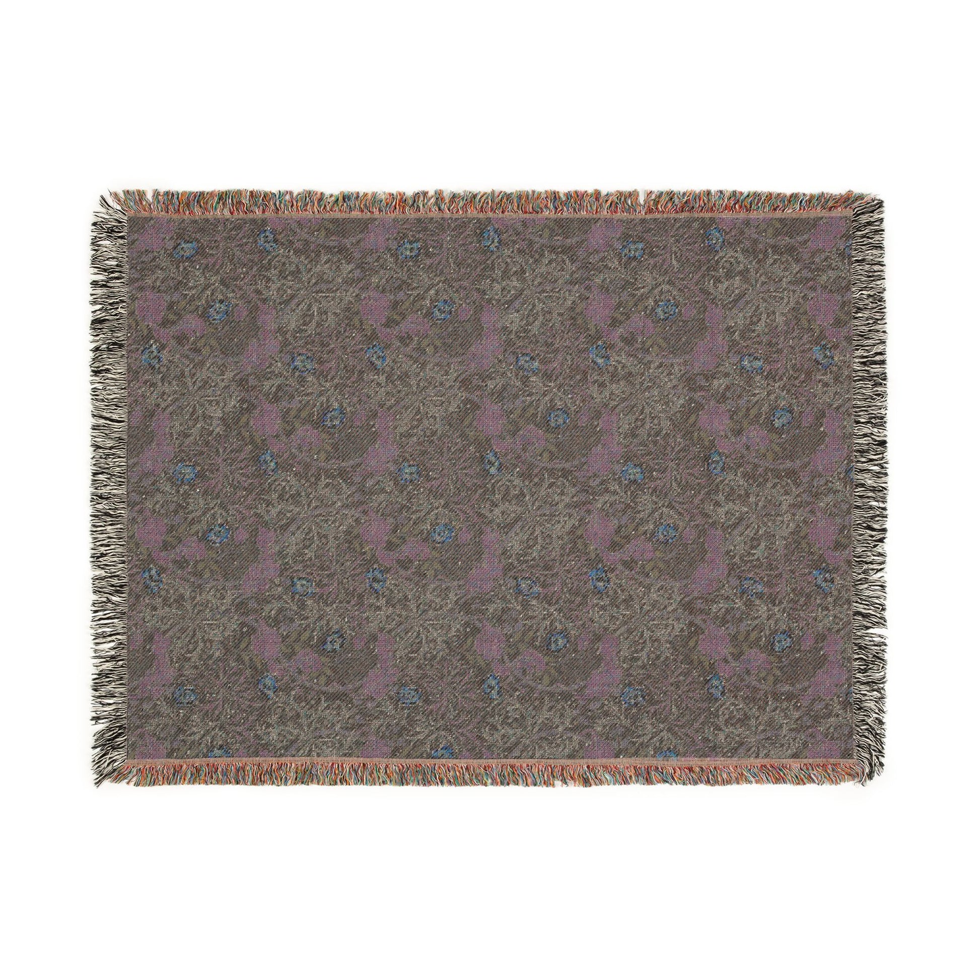 Woven blanket with floral pattern on a plain background