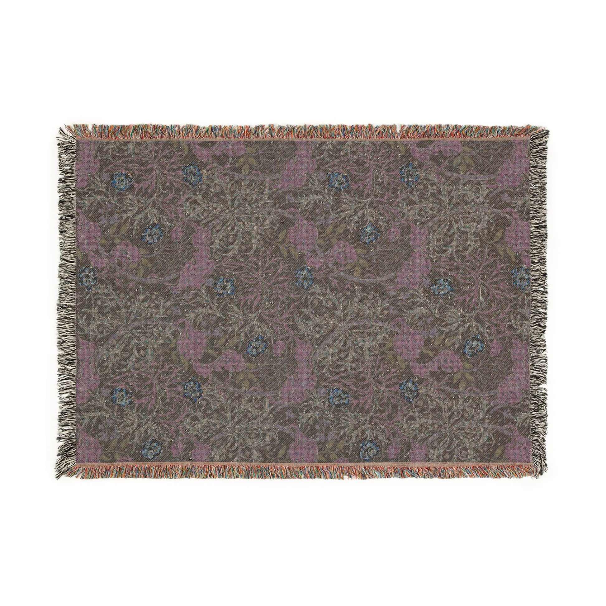 Floral patterned throw blanket with fringe on a white background