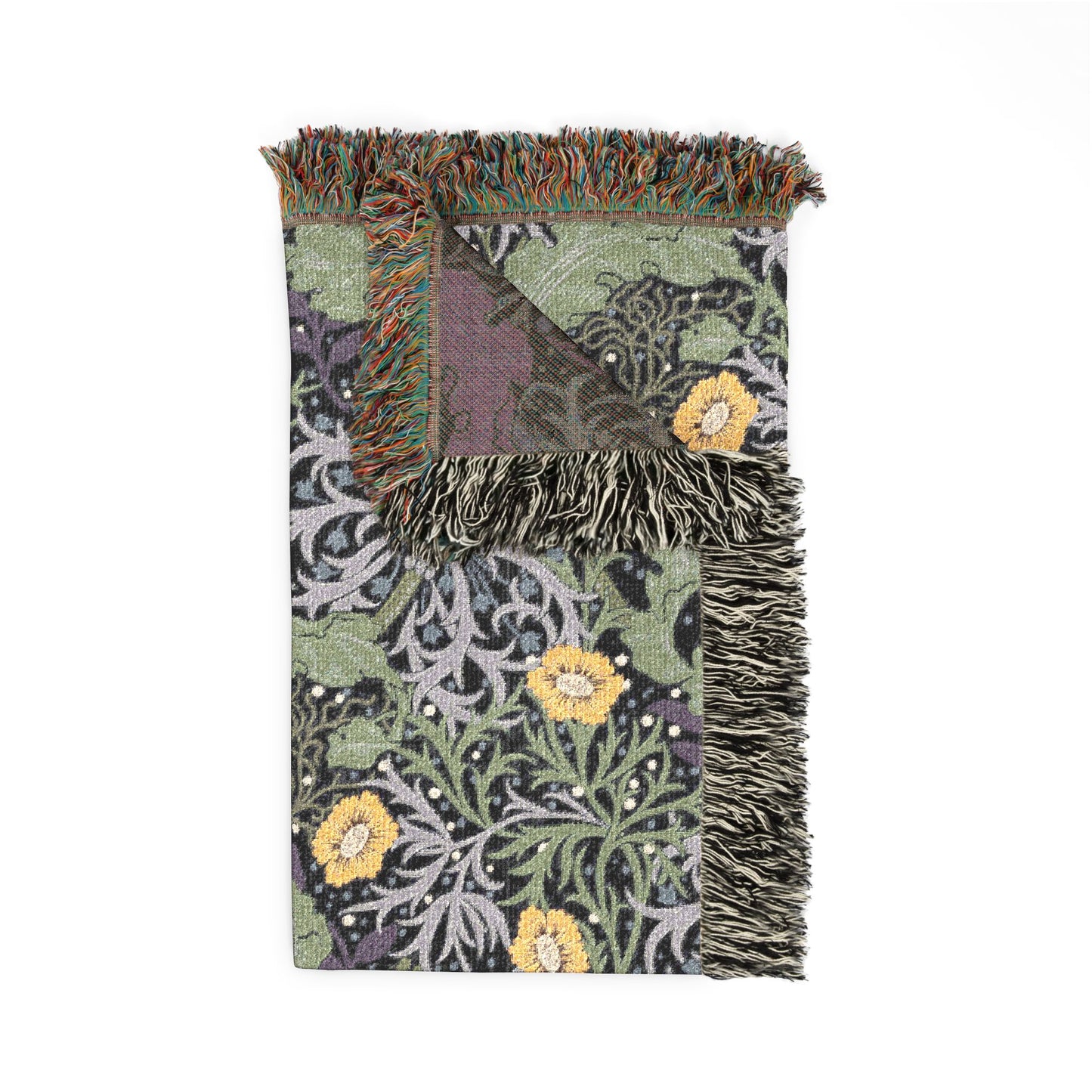 Decorative blanket with floral patterns and fringed edges on a white background