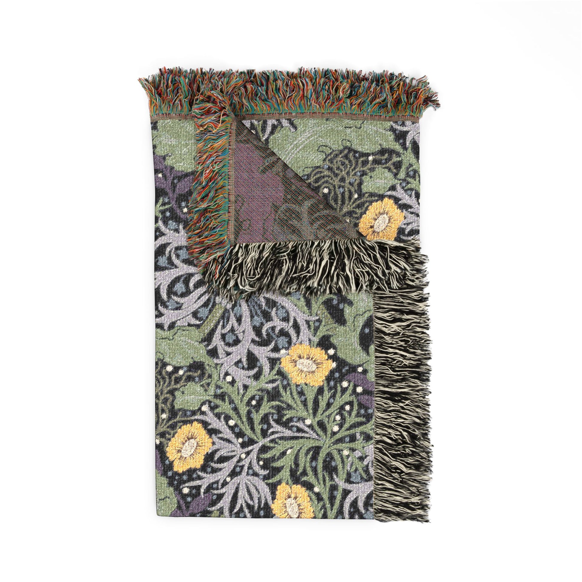 Decorative blanket with floral patterns and fringed edges on a white background