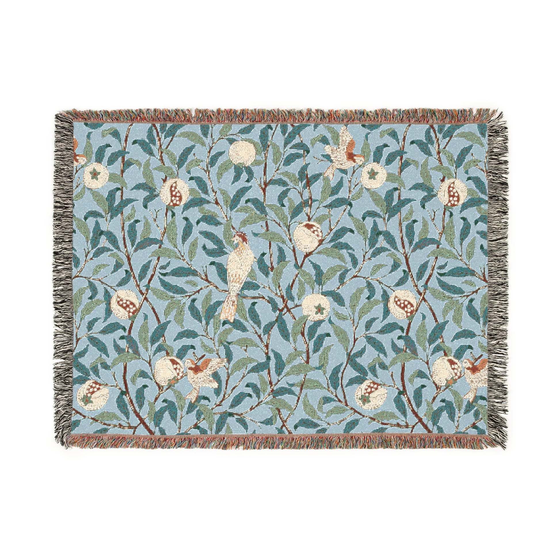 A woven cotton blanket with a bird and pomegranate pattern in Tiffany Blue color, featuring a fringe edge.