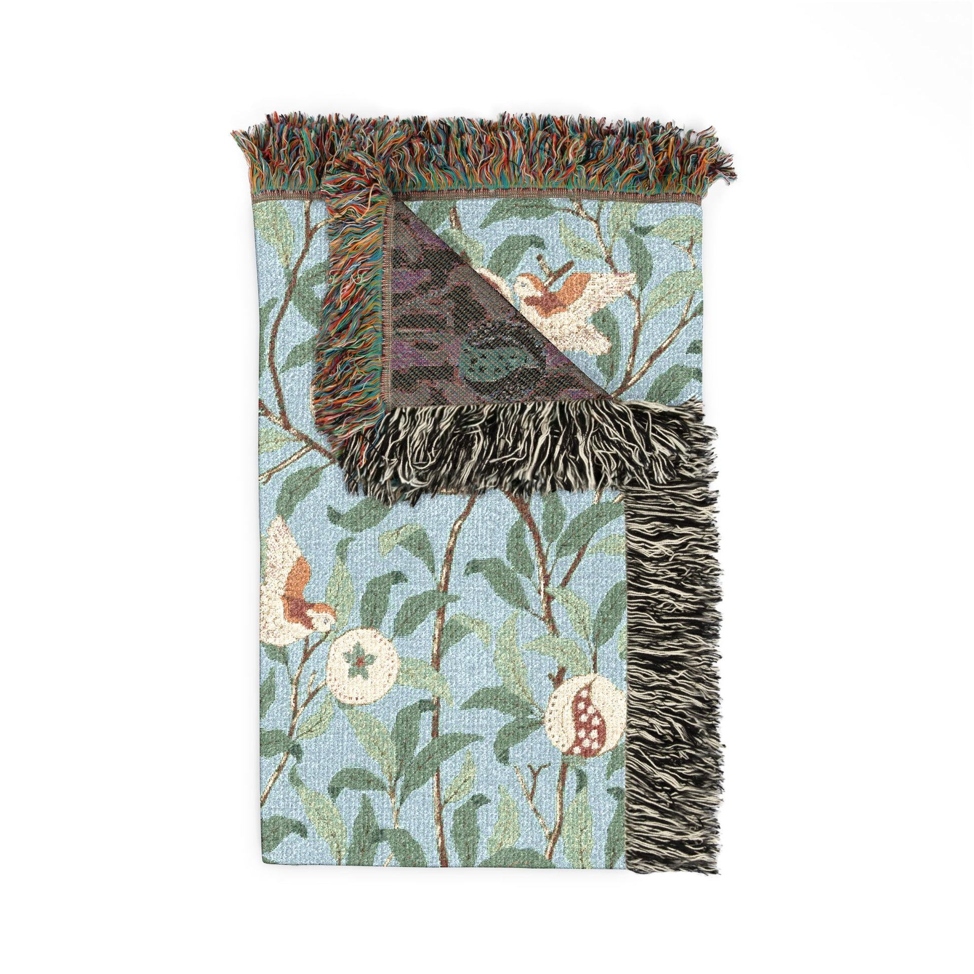 Decorative throw blanket with floral and bird pattern on a white background
