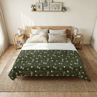 Bedroom with a bed featuring a green floral patterned duvet cover.