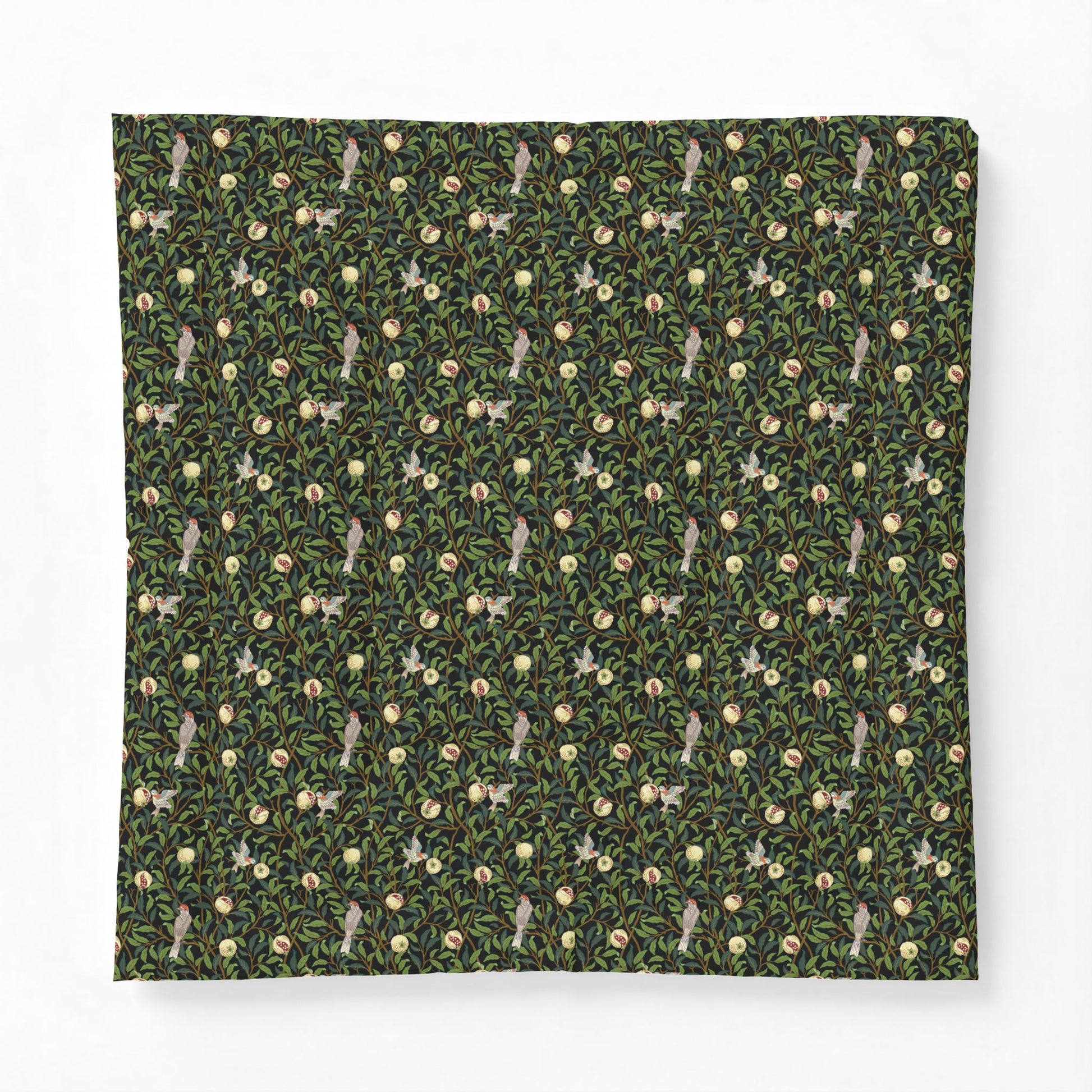 Patterned fabric with small animal and floral design on a green background