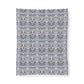 Patterned fabric swatch with a floral design on a white background