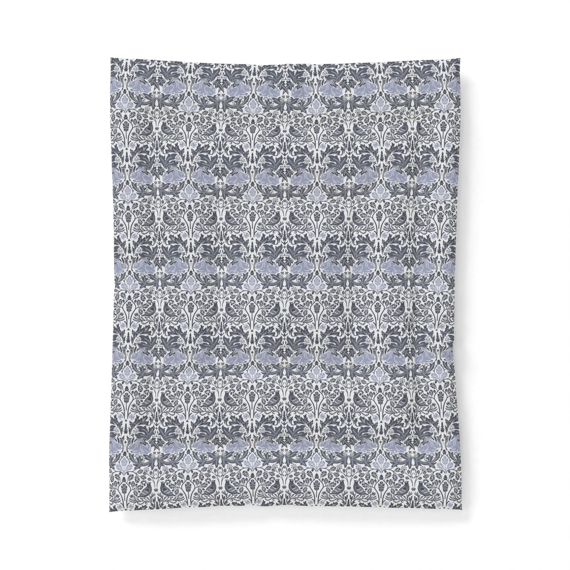 Patterned fabric swatch with a floral design on a white background