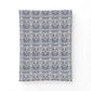 Patterned fabric swatch with a floral design on a white background