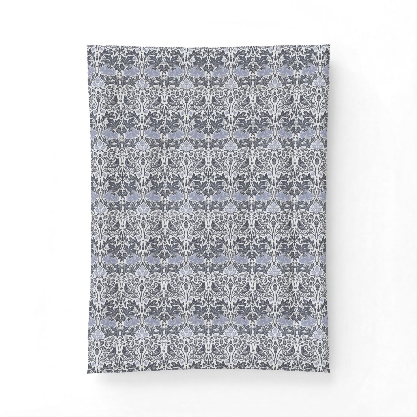 Patterned fabric swatch with a floral design on a white background