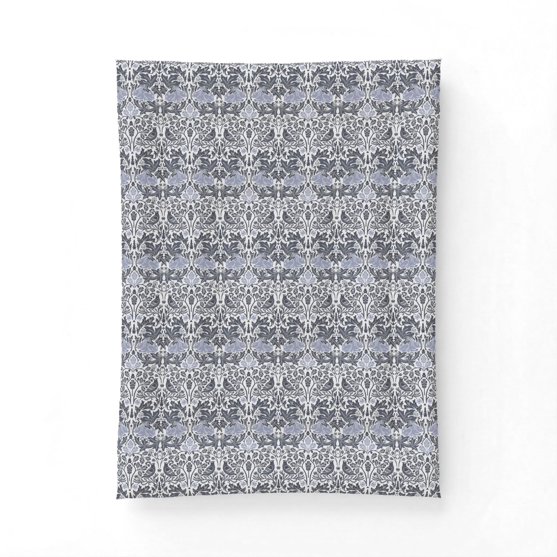 Patterned fabric swatch with a floral design on a white background