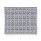 Patterned fabric swatch with a geometric design on a white background