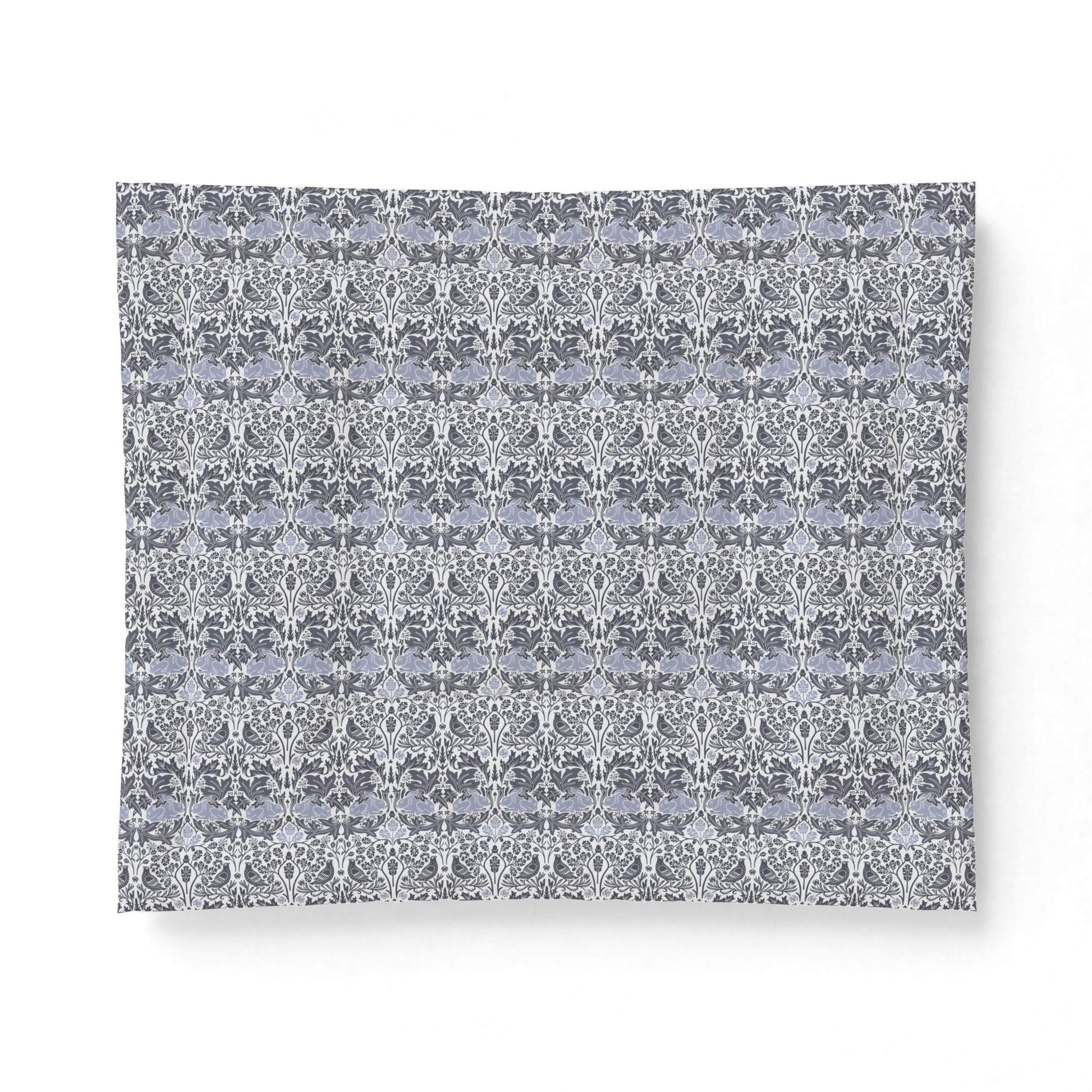 Patterned fabric swatch with a geometric design on a white background