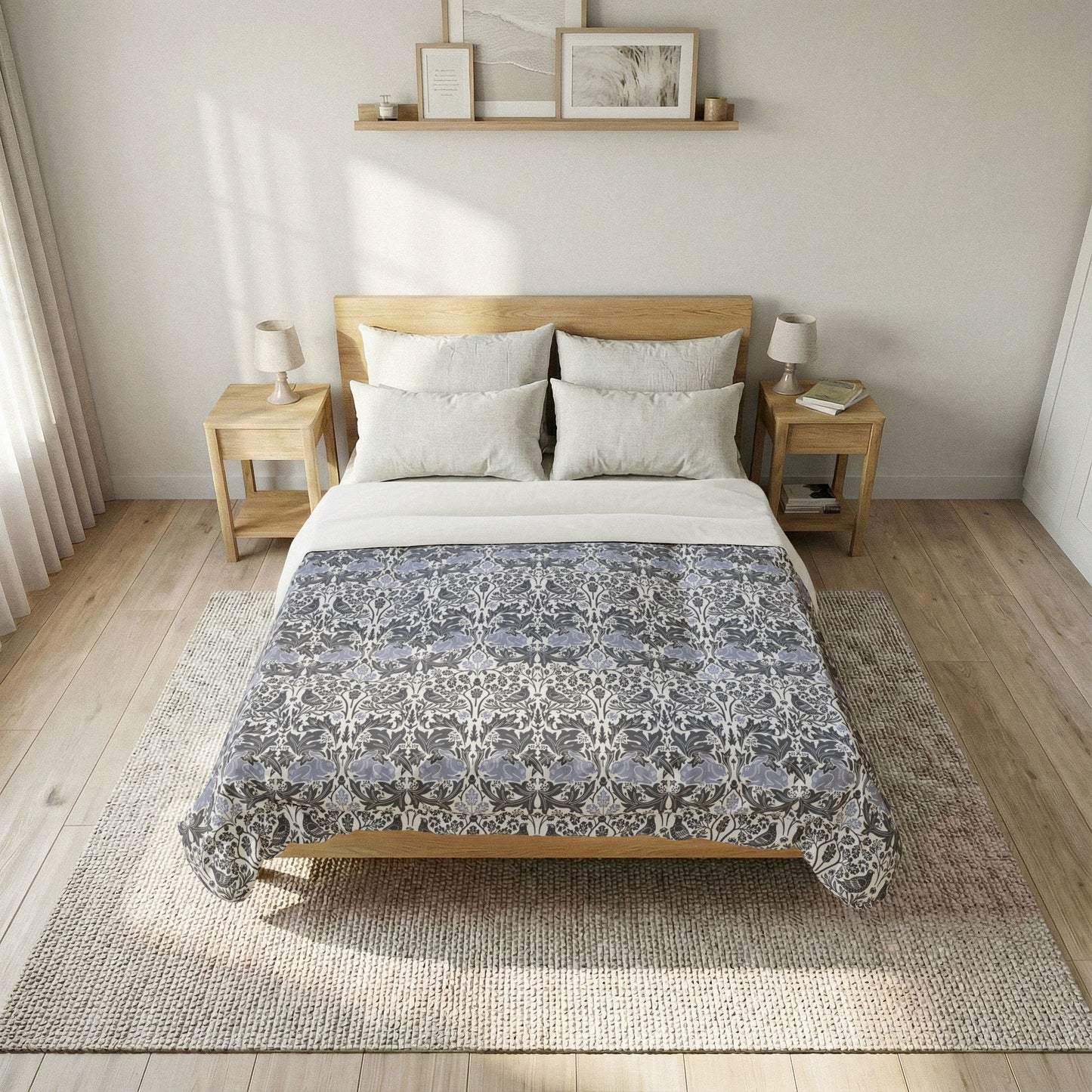 Bed with blue and white zigzag comforter in a bedroom setting