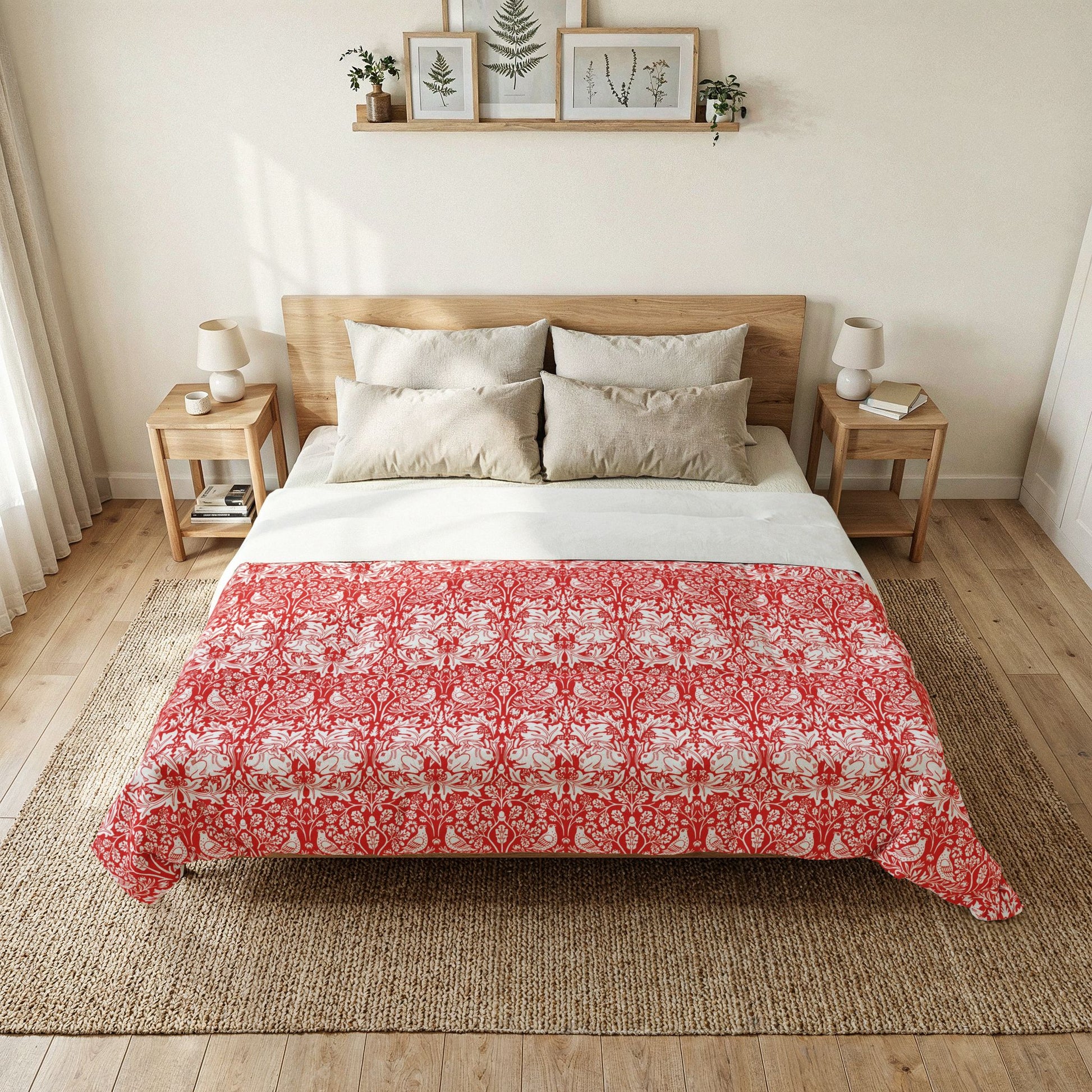 Bedroom with a bed featuring a red and white floral patterned comforter.