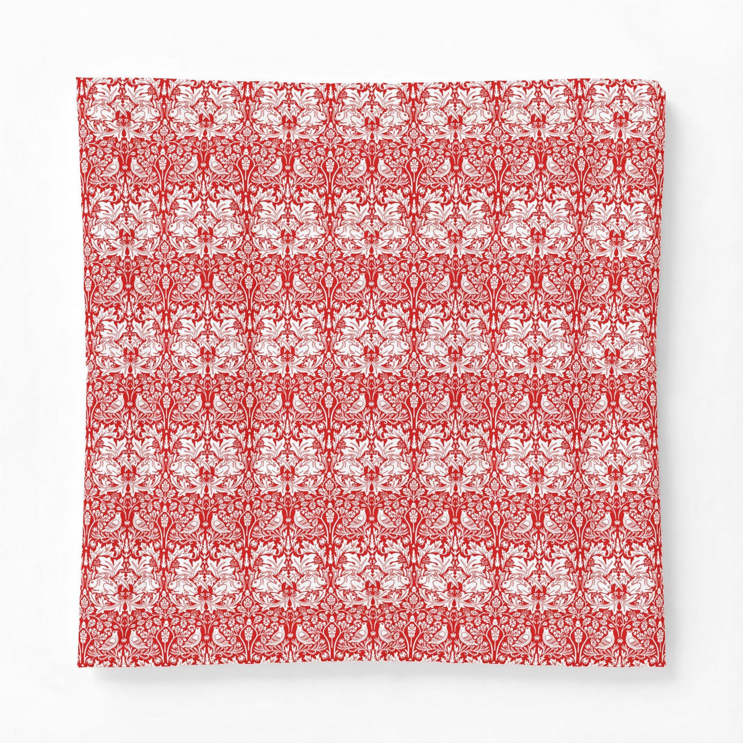 Red and white floral patterned fabric swatch on a white background